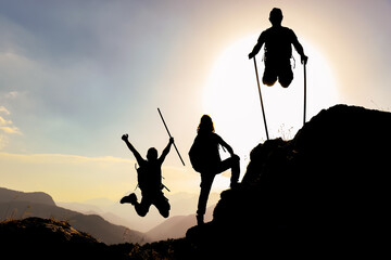 silhouette and enthusiasm of energetic, active and successful climbers