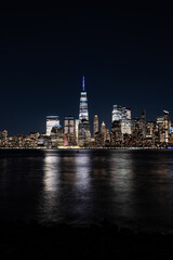 New York City Skyline at Night with reflection of the skyline in the Hudson river