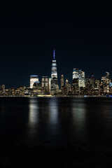 New York City Skyline at Night with reflection of the skyline in the Hudson river