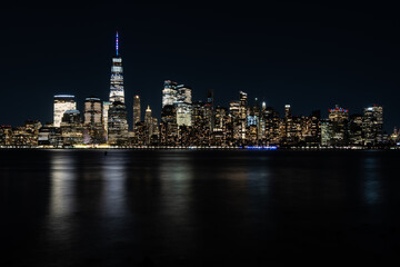 Fototapeta na wymiar New York City Skyline at Night with reflection of the skyline in the Hudson river