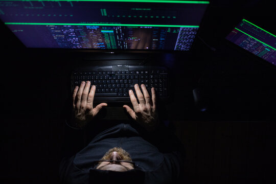 hacker coding at night cybersecurity concept - Powered by Adobe