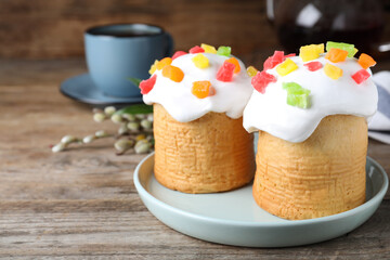 Beautiful Easter cakes on wooden table. Space for text
