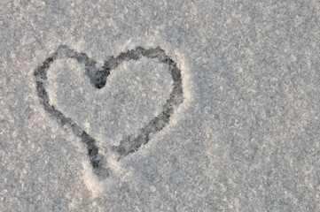 heart drawn in the snow, close-up