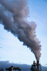 smoke coming out of factory chimney industry and global warming