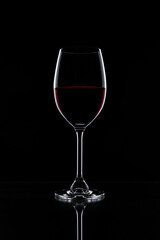 Fototapeta na wymiar Red wine in a glass isolated on black background - realistic photo image - with clip path