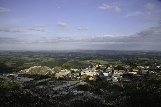 Moonset over the Quarry and Town in the Mountains in Brazil 