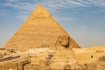 Africa, Egypt, Cairo. Giza plateau. Great Sphinx of Giza in front of the Pyramid of Khafre.