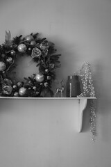 Christmas wreath with the rest of the decor on the wall shelf