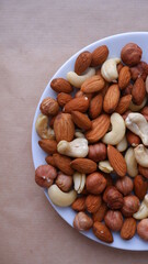 Different nuts are all together. Almonds, hazelnuts, cashews, walnuts. Mix of nuts. Healthy eating.
