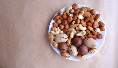 Different nuts are all together. Almonds, hazelnuts, cashews, walnuts. Mix of nuts. Healthy eating.