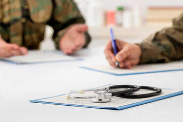 Cropped shot of a soldier patient talking to a army doctor in his office