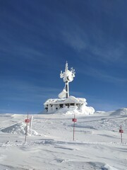 Communications tower on Top of Whistler Peak in winter snow, Whistler, British Columbia, Canada.