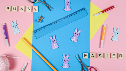 
Easter supplies on pink.
Easter and school supplies for cutting bunny on a pink background, top...