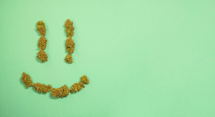 Happy smile made of Cannabis buds. Medical marijuana. Stress relief treatment. Copy space. 