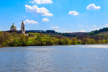 View of the beautiful lake and old orthodox church on a shore