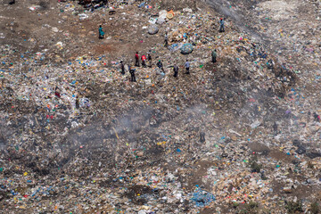 Africa, Kenya, Nairobi, Aerial view of smoldering mountain of trash