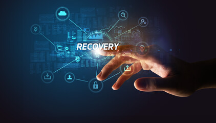 Obraz premium Hand touching RECOVERY inscription, Cybersecurity concept
