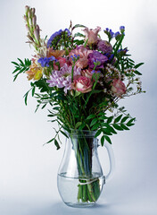 Beautiful bunch of flowers in a glass jar