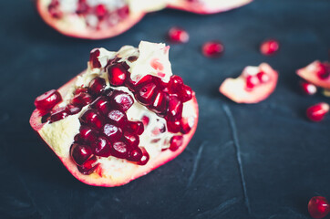 Red pomegranate on dark background