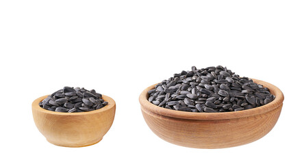 black sunflowers seeds in a wooden bowl  isolated on a white background.