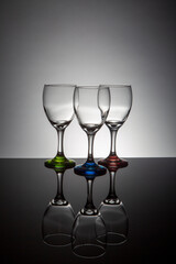 Empty wine glasses with colorful stems
