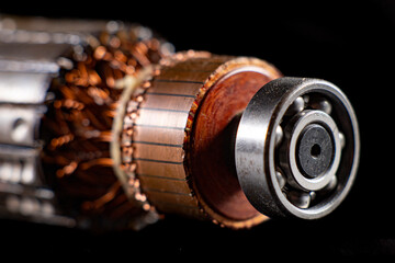 Rotor of a small electric motor. Spare parts in the electrical workshop. - obrazy, fototapety, plakaty