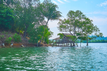 The small stilt hut on the river, Chaung Tha, Myanmar