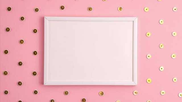 Stop motion animation mockup of white frame and gold colored push pins pattern around it on pink background. Flat lay top view. Education template back to school and online study concept