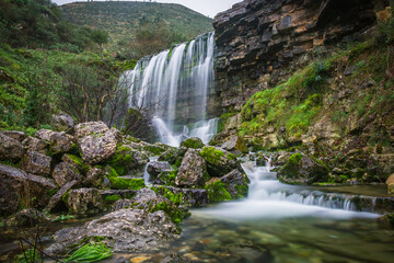 Beautiful waterfall in the mountains of Serra de Aire, Portugal. Long exposure of the waterfall of Fornea in Porto de Mos, Portugal. 