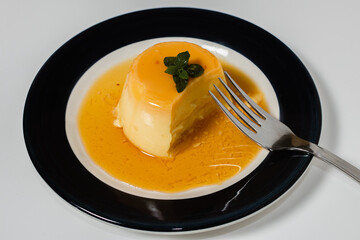 Delicious typical dessert from South America called Flan, made with eggs, milk, vanilla and flavored with caramel.