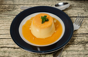 Delicious typical dessert from South America called Flan, made with eggs, milk, vanilla and flavored with caramel.