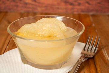 Fresh half Pears Served with sweet syrup. Wooden table background.