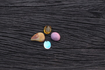 various agate on black ironwood