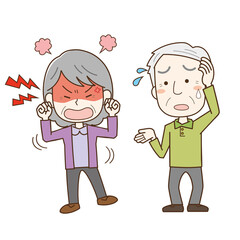 認知症でイライラする高齢女性を介護する高齢男性