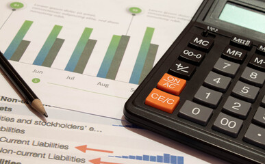 Pen, business analysis report ,calculator on desk of finance adviser . top view, above view. concept of data analysis