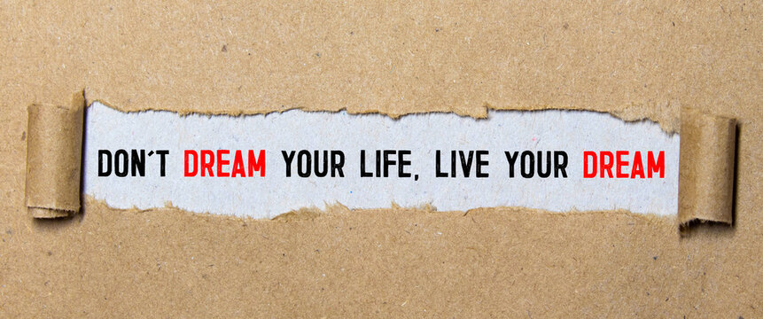 Don't dream your life, live your dream text on red background appears behind torn paper