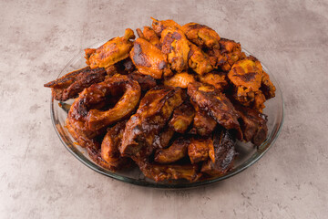 Hot pork ribs with BBQ sauce on the table
