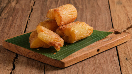 Fried Cassava served on wooden table