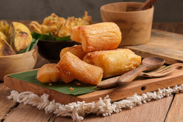 Fried Cassava served on wooden table