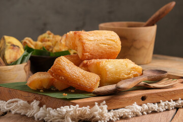 Fried Cassava served on wooden table