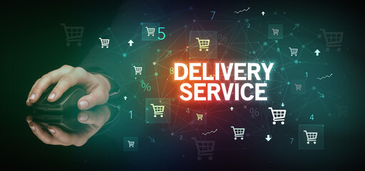 hand holding wireless peripheral with DELIVERY SERVICE inscription, online shopping concept