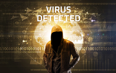 Faceless hacker at work with VIRUS DETECTED inscription, Computer security concept