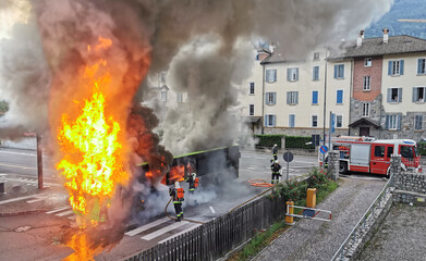 A large fire starts in the back of a bus just before it leaves the public station in the city...