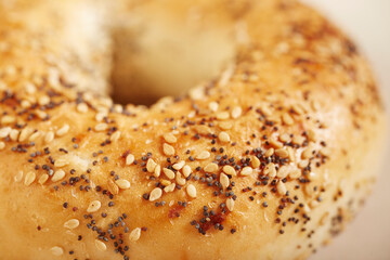 Closeup of an everything bagel. A traditional food in New York City, USA