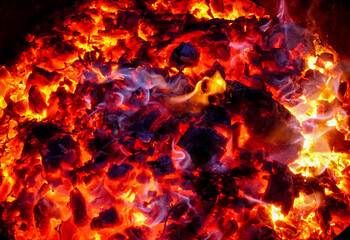 Fototapeta na wymiar Glowing Red Coals of Fire