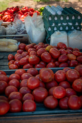 selling fruits, vegetables and eggs in a street market