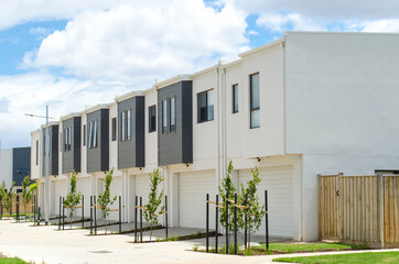 A row of residential townhomes or townhouses in Melbourne's suburb, VIC Australia. Concept of real...