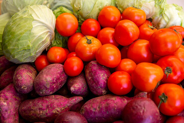 A small variety of fruits and vegetables that have just arrived from the organic fair.