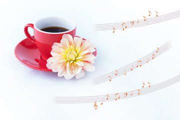 ダリアの花と赤いコーヒーカップに入れたコーヒーと楽譜の合成