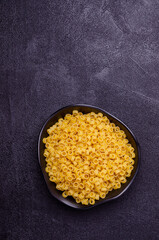 Dry pasta in a ceramic dish